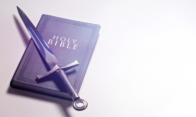 Bible and Sword on a Bright White Background