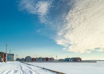 Commercial fishery buildings on the wharf during winter in rural Prince Edward Island, Canada.