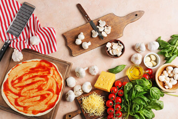 Fototapeta na wymiar Ingredients for tasty pizza on color background