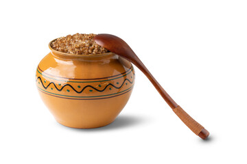 cooked buckwheat porridge in a clay pot in the oven isolated on white background