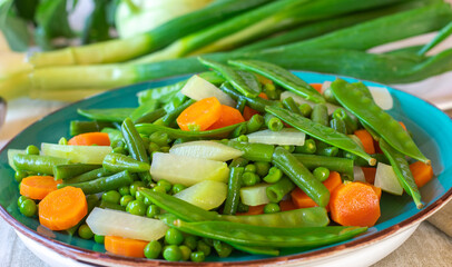 A Plate of fresh cooked spring vegetables