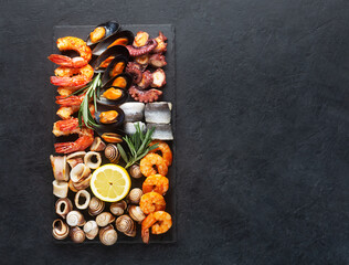 Seafood charcuterie board with shrimp, oysters, fish and octopus
