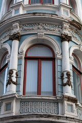 Fototapeta na wymiar CHERNIVTSI, UKRAINE - JULY 16, 2017: Ancient window on building in Chernivtsi, Ukraine