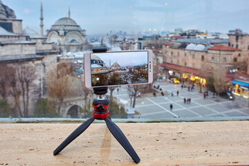 Video recording for travel vlogs using smartphone which is installed in holder tripod.