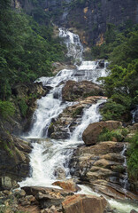 Fototapeta na wymiar The stream of water between the rocks in the mountains Sri Lanka.
