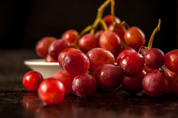 Closeup on grapes on black background