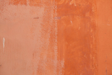 Terracotta painted stucco wall. Background texture