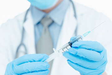 vaccines fight against virus covid-19 corona virus, doctor or scientist in laboratory holding a syringe with liquid vaccines.