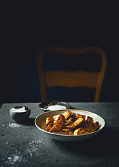 Rustic oven baked potatoes with sea salt and herbs. Copy space