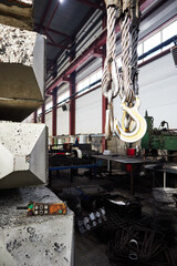 Obraz na płótnie Canvas crane hooks in a factory concrete production