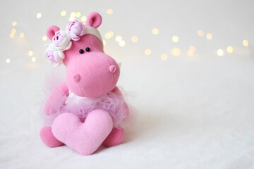 Pink hippo, spring composition with flowers and garland.