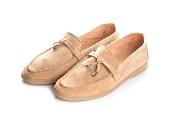 Pair of beige modern unisex loafers on white background