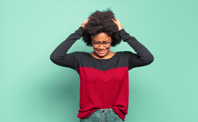 feeling stressed and frustrated, raising hands to head, feeling tired, unhappy and with migraine