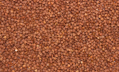 Buckwheat background, texture, the rump. Roasted buckwheat. Dietary product.