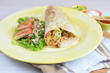 Traditional Mexican food in beautiful marbled colored plates on white wooden background