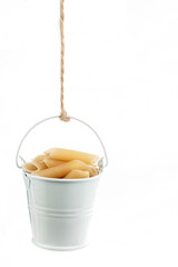 A full bucket of pasta hanging from a rope.