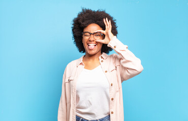  smiling happily with funny face, joking and looking through peephole, spying on secrets