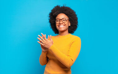  feeling happy and successful, smiling and clapping hands, saying congratulations with an applause