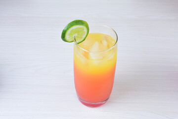 Colorful drinks, Italian sodas with ice, fruit flavors on white wooden background