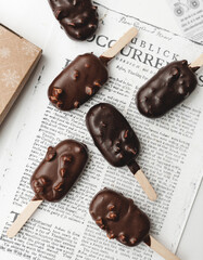 chocolate ice cream on newspaper