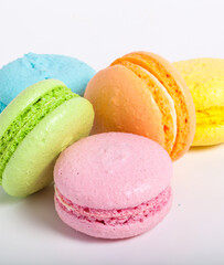 Colorful cake macaroons on a light background