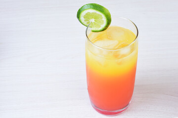 Colorful drinks, Italian sodas with ice, fruit flavors on white wooden background