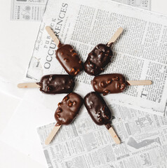 chocolate ice cream on newspaper