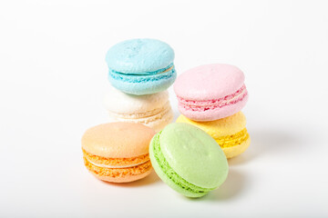 Colorful cake macaroons on a light background