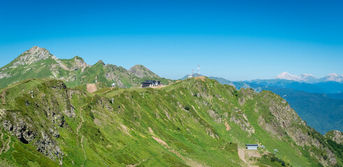 Fototapeta premium Summer landscapes of the Caucasus mountains in Rosa Khutor, Russia, Sochi, Krasnaya Polyana. Peak 2320m
