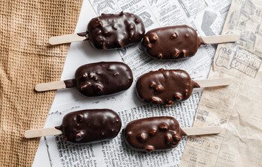 chocolate ice cream on newspaper