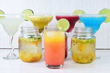 Colorful drinks, Italian sodas with ice, fruit flavors on white wooden background