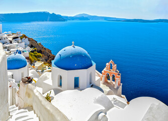 Fototapeta na wymiar traditional greek church over the blue sea of ​​the aegean sea 