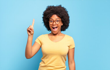  feeling like a happy and excited genius after realizing an idea, cheerfully raising finger, eureka!