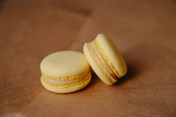 yellow macaroons lie on a crafting background