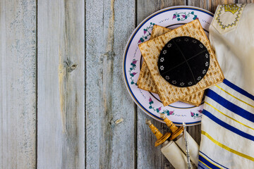 Pesach Passover symbols of great Jewish holiday traditional matzah, seder, kippah and tallit, torah scroll