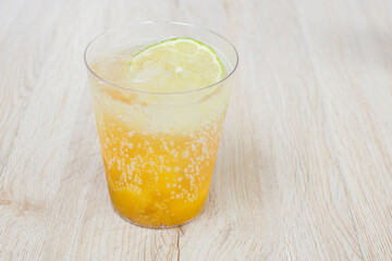 italian flavored sodas with ice and tropical flavors on white wooden background