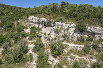 Fototapeta na wymiar Aerial drone view of hideout of Tito's Cave on Josip Broz on Vis Island in Croatia summer