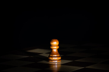 Wooden chess piece.