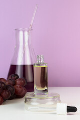 Obraz na płótnie Canvas Organic bio grape cosmetics. Extract, grape seed oils, serum. Abstract cosmetic laboratory.