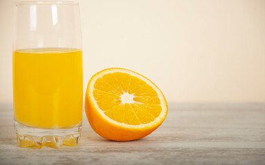 orange and natural orange juice on a white table background