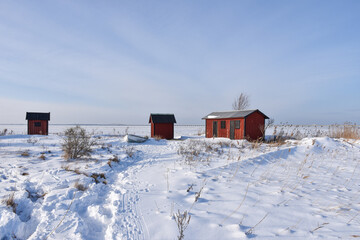 Red fishing sheds by the coast