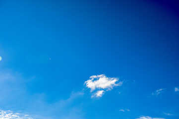 Fototapeta na wymiar Blue sky with scattered blue clouds