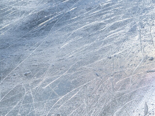 Ice rink surface texture with scratches from the ice skates.