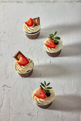 Cupcake decorated with strawberries and blueberries