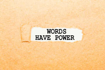 text WORDS HAVE POWER on a torn piece of paper, business concept