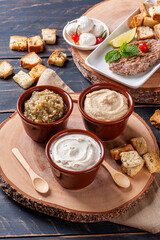 .Meze is an oriental set of appetizers served in small bowls with babaganush, curd, hummus and kibbeh