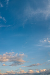 A sky with white clouds and beautiful sunbeams passing through the clouds. The magical beauty of the sky with the sun and clouds