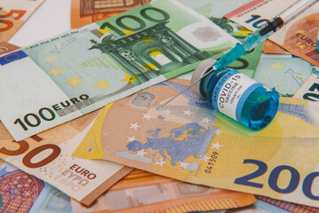 Concept for economy, finance, budget, investment and business, New year 2021, Covid-19 vaccination over the world, Euro banknotes
