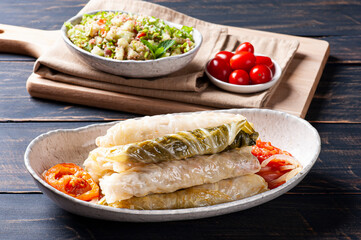 .Arabic food. Appetizing cabbage rolls on wood background - Dolma, sarma, or golubtsy