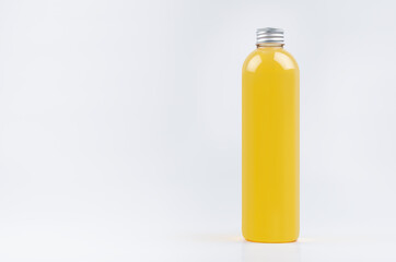 Transparent plastic tall thin bottle with orange drink, cooking oil or cosmetic produce, silver cap mockup on white background. Template for design.
